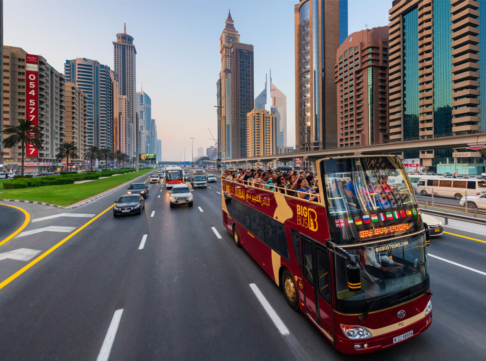 1-big-bus-tours-sightseeing-bus-driving-on-highway-in-dubai